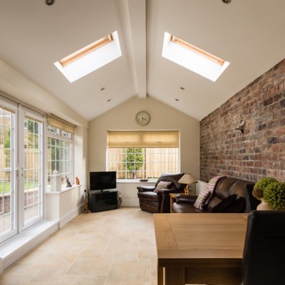Extension with vaulted ceiling and internal brickwork feature wall.