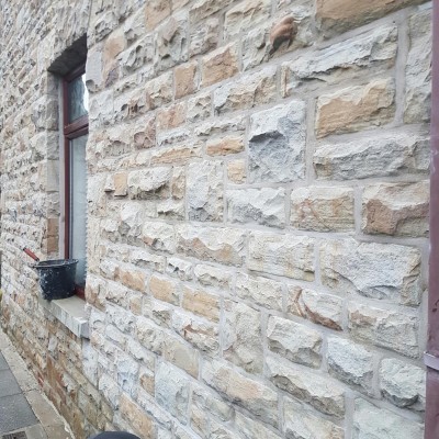 Lime mortar. Coursed stone work repointing, Maesteg.